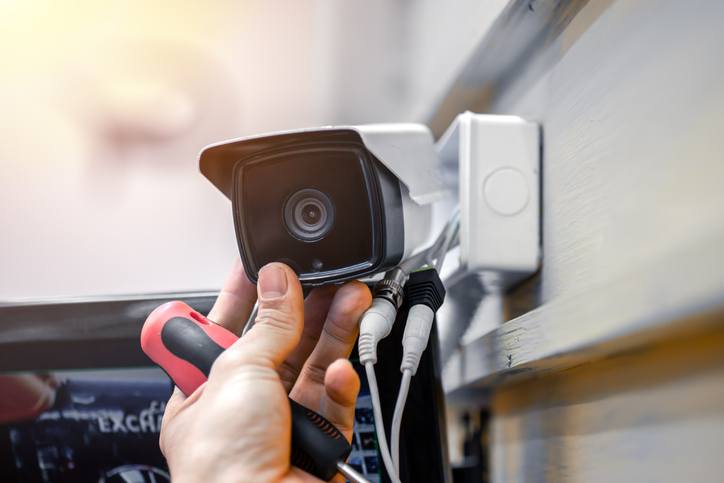 Image of someone fixing a cctv camera